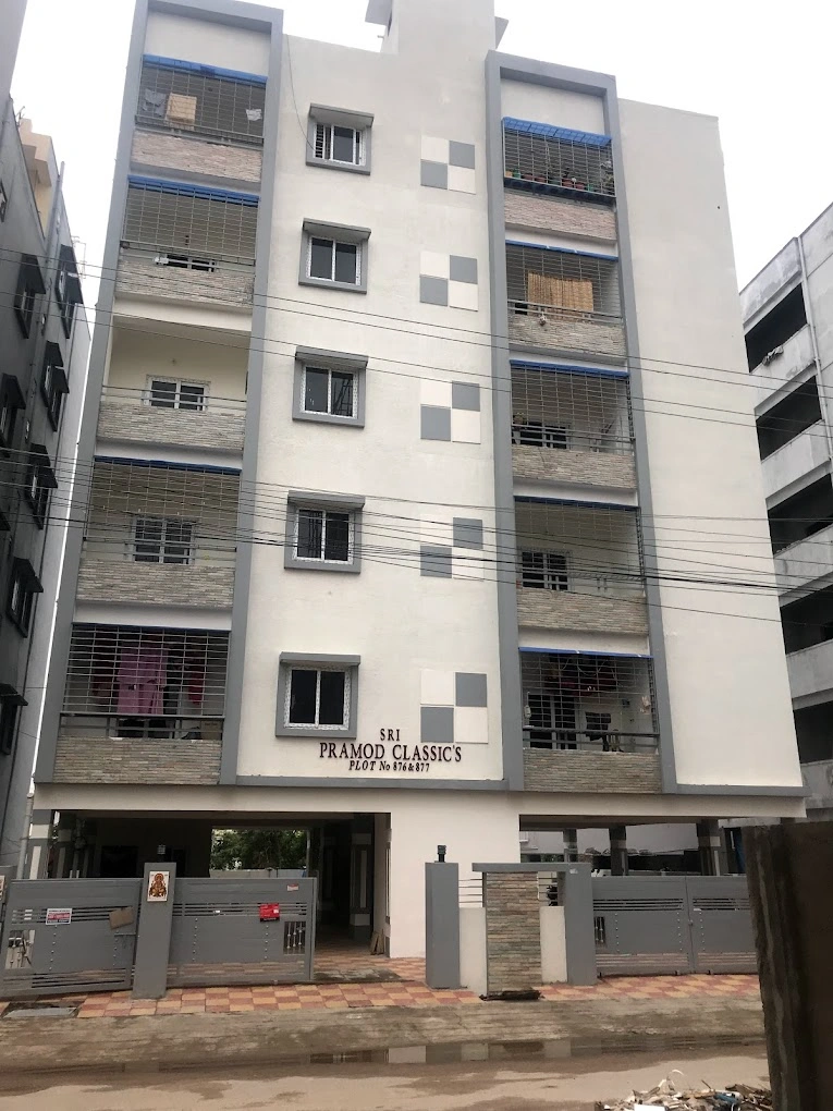 Pramod Residency by Risinia Builders featuring a modern residential complex